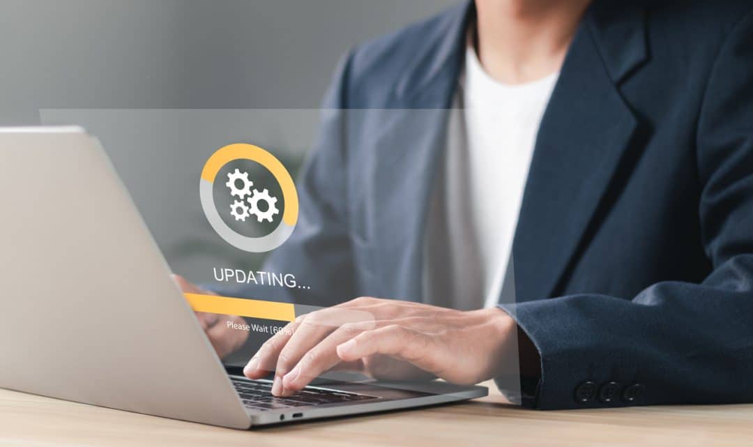 Businessman working and Installing update process. Software update or operating system upgrade to keep the device up to date with added functionality in new version and improve security.